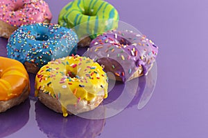 Batch of Rainbow Colored Glazed Donuts