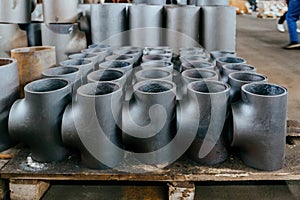 Batch of T shape pipe parts in factory