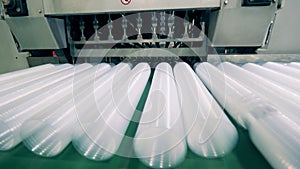 Batches of plastic cups are getting mechanically relocated