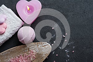 Bath bomb closeup with pink lit candle