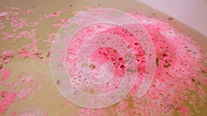 Bath bomb dissolves in water photo