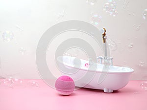 Bath bombs in bathroom, soap bubbles, bathtube miniature