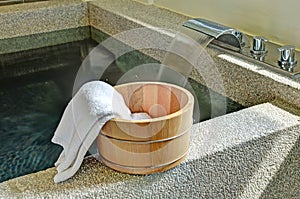 Bath bucket with a towel