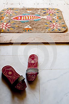 Bath clogs and felt doormat at a Turkish hamam photo