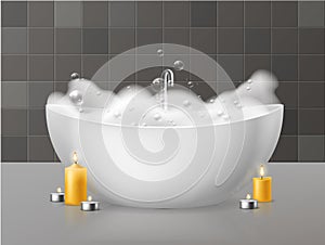 Bath with foam. Relaxing bath with soap bubbles foaming, bubbly bathtub in luxurious bathroom and burning candles