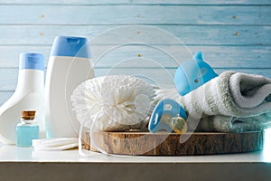 Bath products for children on white table and blue background