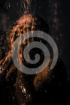 Bath ritual of Hindu devotee during the Thaipusam  festival in Malaysia