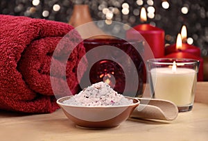 Bath salt, red towel and candle on wooden background spa still life stock photo images