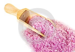 Bath salt with wooden scoop isolated on white background.