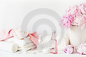 Bath and spa with peony flowers beauty products towels