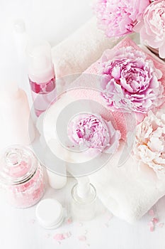 Bath and spa with peony flowers beauty products towels