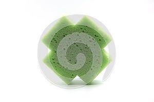 Bath sponge. Green porous bath sponge isolated over white