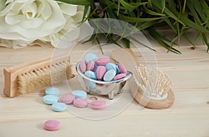 Bath Time color tablets for kids on wood background