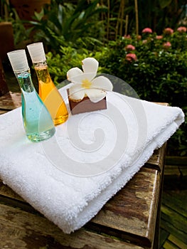 Bath towel, bath jel and candle flower shape as spa set