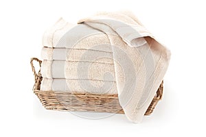 Bath towels in a wicker basket