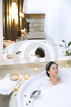 Bath in a whirlpool hot tub jacuzzi. photo