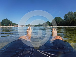 Bather immersed in the river in the summer