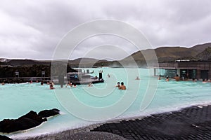 Bathers in blue lagoon, Iceland photo