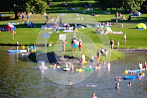 Bathers at a lake in summer, in intentional blur photo
