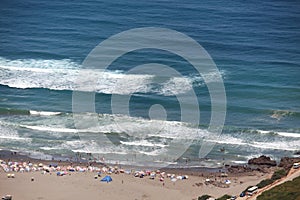 Bathers on the sandy beach of the Algerian coast