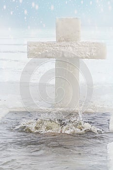 bathing in the hole for baptism. A man is swimming in an ice hole in the winter