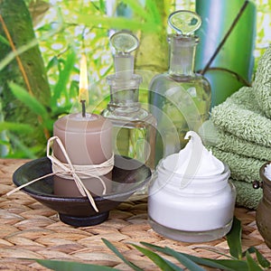 Bathing salt and massage oils with a stack of towels