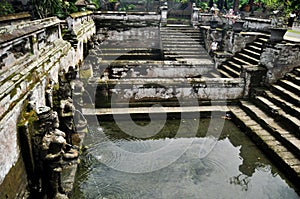 Bathing temple figures or holy water fountain of Goa Gajah or Elephant Cave significant Hindu archaeological site for travelers