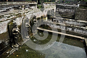 Bathing temple figures or holy water fountain of Goa Gajah or Elephant Cave significant Hindu archaeological site for travelers