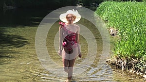 Bathing woman with summer hat