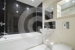 Bathroom with black stone tiles
