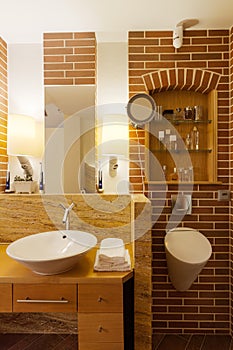 Bathroom with brick wall