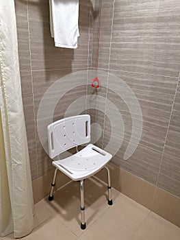 Bathroom with chair and emergency alarm in hospital