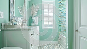 The bathroom continues the beachy theme with its seafoam green walls and sandycolored tile flooring. The shower features photo