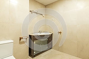 Bathroom with dark wood furniture, tempered glass doors