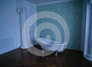 Bathroom green walls brown floor white columns