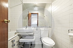 Bathroom with individual shower cabin, folding bidet