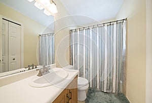 Bathroom interior with bright lighting fixtures and vanity sink