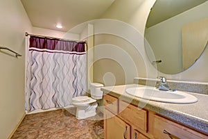 Bathroom interior with colorful shower curtain