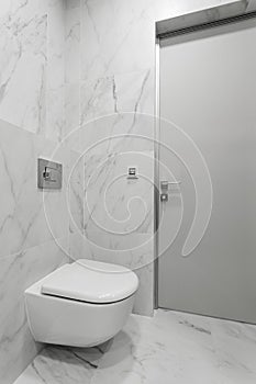 bathroom interior with white toilet and bidet