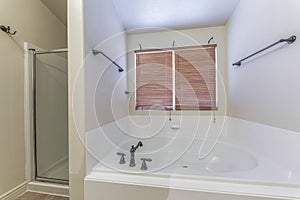 Bathroom interior with white walls and antiqued fixtures