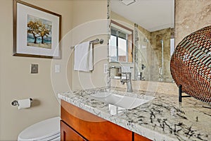 Bathroom with large mirror and granite countertop