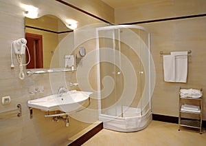 Bathroom in light tones with a shower booth