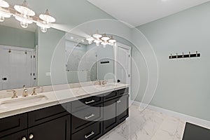 a bathroom with a marble counter and two sinks in the bath room