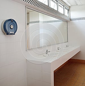 Bathroom at office.Handbasin and mirror in toilet photo