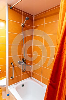 Bathroom in orange colors closeup photo