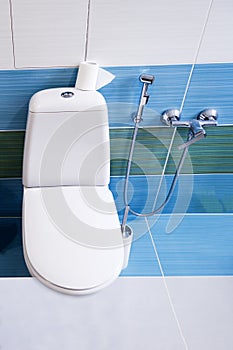 . bathroom in a private house. white toilet seat. bidet