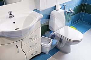 . bathroom in a private house. white toilet seat. bidet