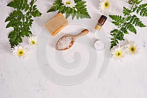 Bathroom salt, soap and aroma oil for spa on white background to photo