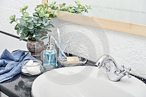 Bathroom set with toothbrushes, towels and soap