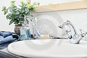 Bathroom set with toothbrushes, towels and soap